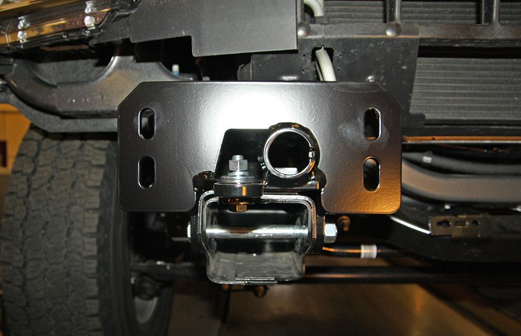 Fig.H Fig.I 6. On each side, remove four 18mm (head) nuts and double backing plate attaching the frame guard to the frame rail (Fig.H).