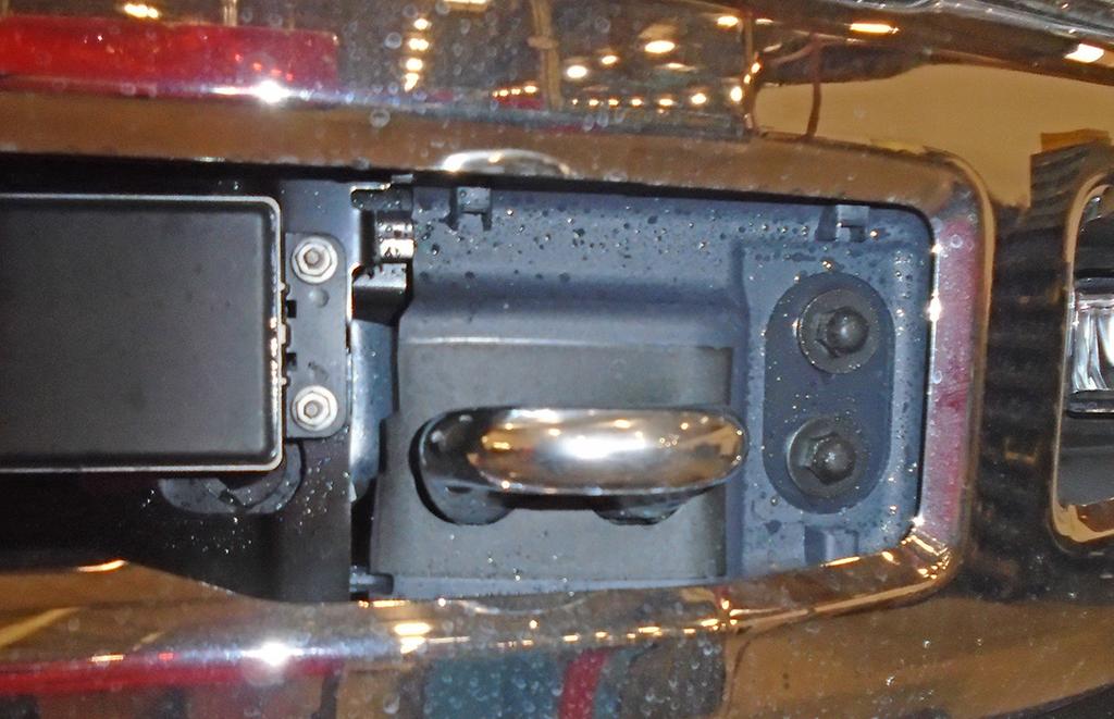 10. On each side, remove four 18mm (head) bolts and threaded double-nut plate on the backside attaching the bumper to the frame (Fig.K arrows).