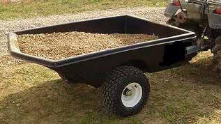 CARTS Designed for ATVS & Lawn tractors Formed metal main frame Hi-strength plastic trailer bed Tires: 18 x 9.