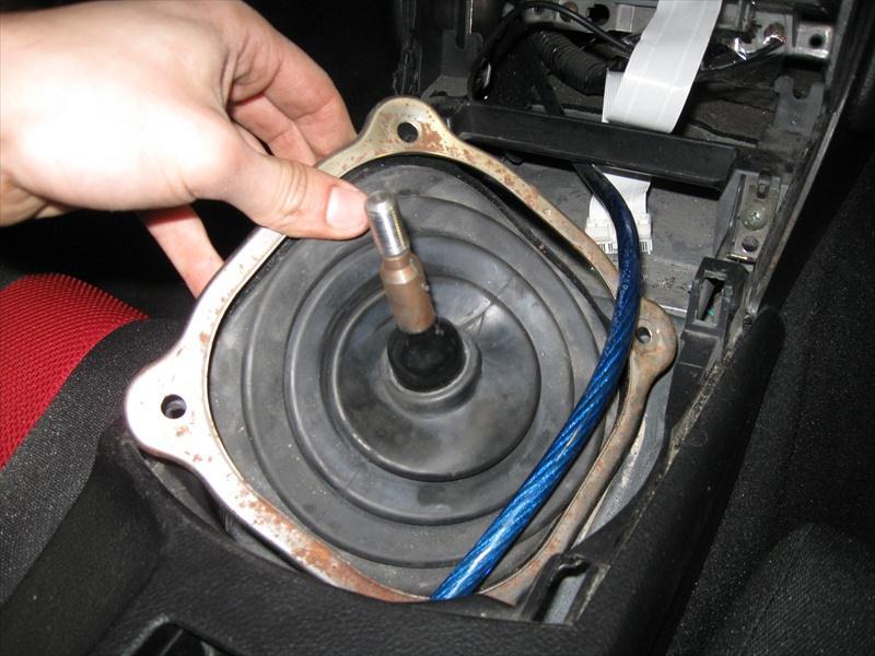 15. Remove the metal shifter surrounding from the car and put it aside for re-installation later.
