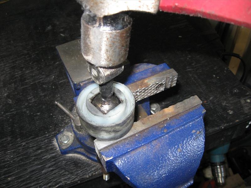 It is a tight fit so a good way to remove it is to place the cup and shifter on a bench vise as