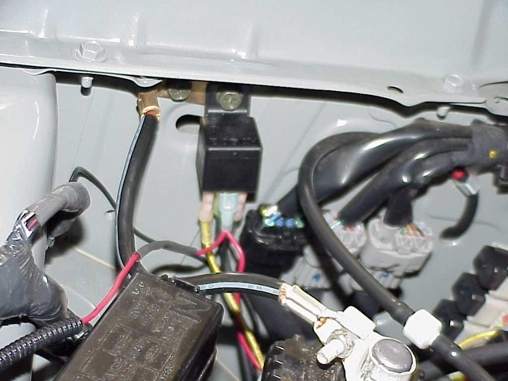 10. Now you will install the supplied relay and harness. In the battery compartment you will see the battery ground cable secured by two 6MM bolts.