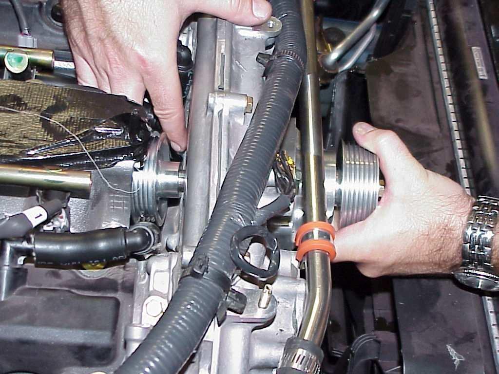 Attach the 2 90 fittings to the ends of the hose. Cut the OEM breather line in the center and re-attach to the valve breather nipples, trim the other ends and attach to the 90 fittings.