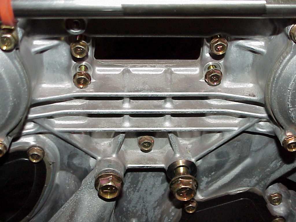 Use appropriate caution when installing the hose assemblies. A dry type silicone spray may help some. 15. Back to the front of the engine timing cover area you will see a rectangular opening.