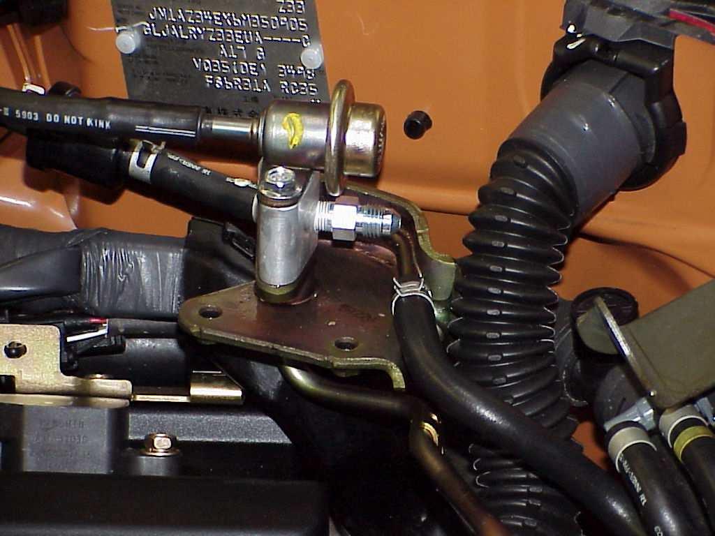 19. On the passenger side fuel rail there is a hard fuel feed line.