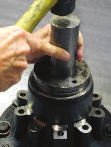 (Image E) Inspect the bearing surface for any damage, which might have occurred during installation. There should be no scoring of the new bearing cup surface.