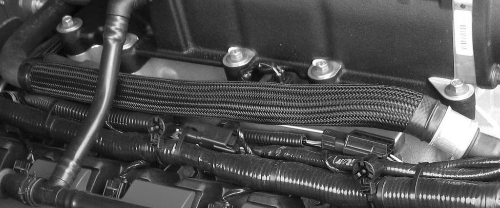 a) Install one length of protective sleeve (1311-18K579SLV) onto the passenger side heater hose.