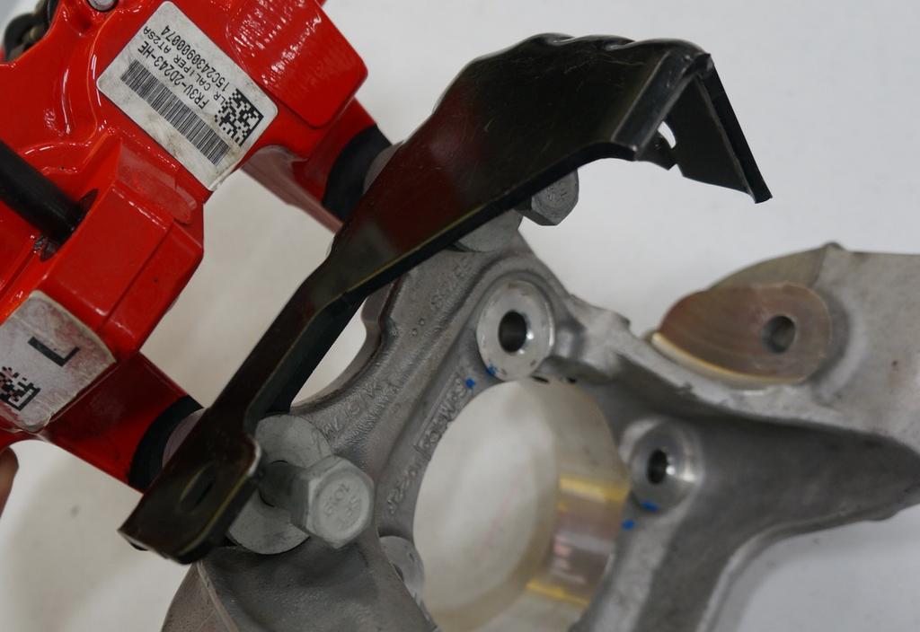 - Install the Supplied Rear calipers with the bleeder screws facing UP.