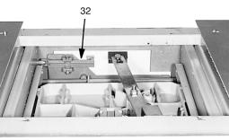 Page 7 openings in the rear barrier. As the shutter closes the openings, green and white striped labels are uncovered to visually indicate that the shutter is closed.