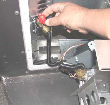 Re-attach the power wires to the receiver module. 23. Re-attach the flexible gas line to the gas control valve.