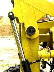 Cylinder Maintenance The hydraulic cylinders are easily removed for repair or maintenance simply by: Lowering the fork (or deflector) to the down position and unhooking the hydraulic lines.