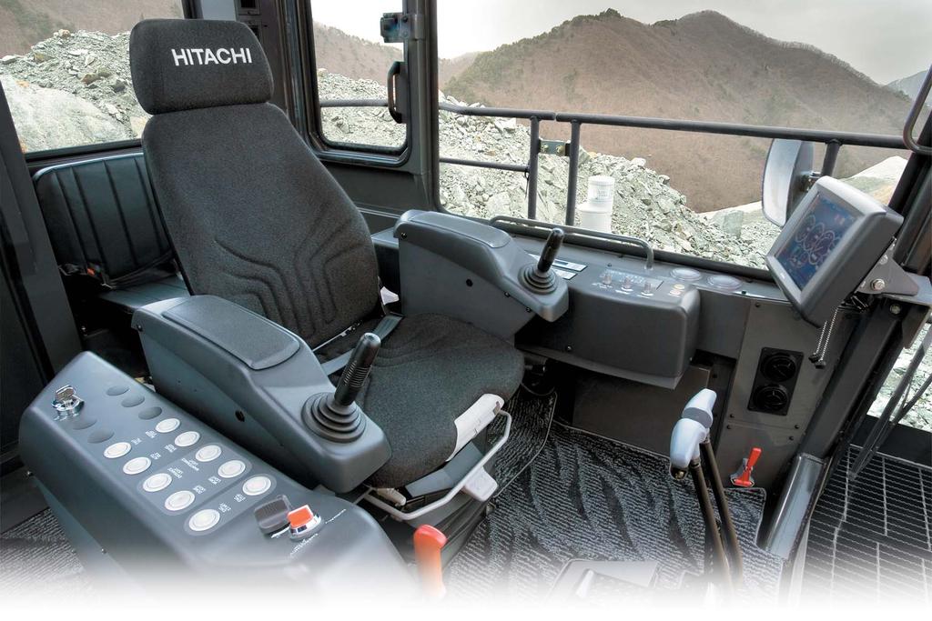 GIANTComfortable Rugged Comfortable Cab Protects the operator from falling objects. Efficient Cab Layout All controls within natural reach of operator.
