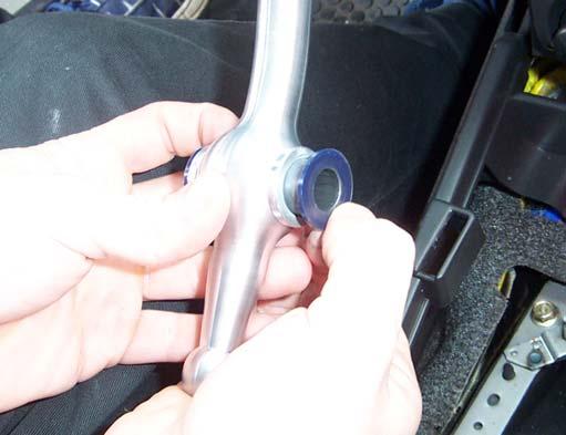 Remove the rubber bushings on either side of the shifter and clean them with
