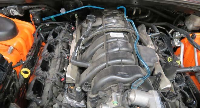 Remove the EVAP hose from the fitting at the front of the manifold. NOTE: Later 5.