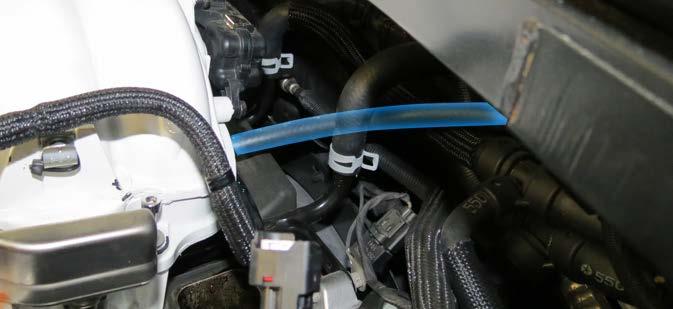 Detach the quick release fuel line from the driver side fuel rail.