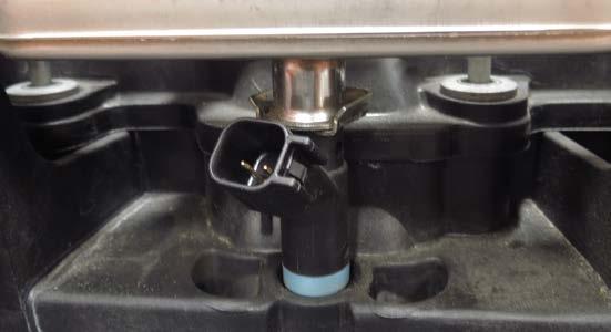 14. Remove the eight (8) injector retaining clips and pull the injectors
