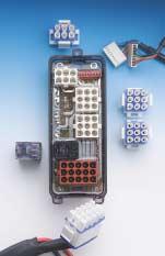 High-tech circuit interrupters replace circuit breakers for a more compact and less complicated wiring harness.
