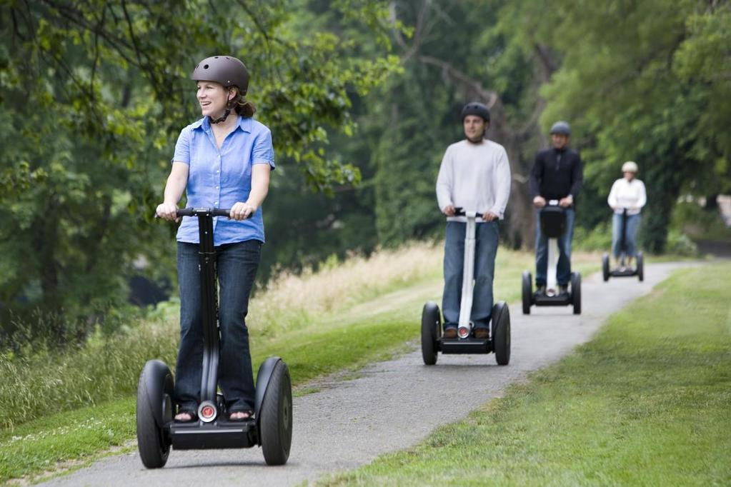 Segway personal transport vehicle for urban areas. Two large wheels to be able to navigate tight spaces and small steps and bumps.