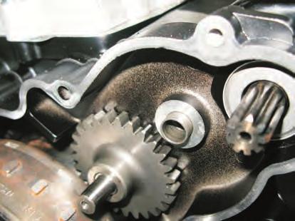 wrench) and remove the cover together with stator (3), timing drive