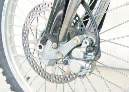 the left-hand side; - remove the six screws (3) and the fork leg guards (4); - remove
