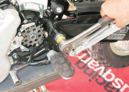 REAR SUSPENSION Disengage the rear brake pedal return spring (6). TIGHTENING TORQUE FIGURES 8=80 Nm - 8.