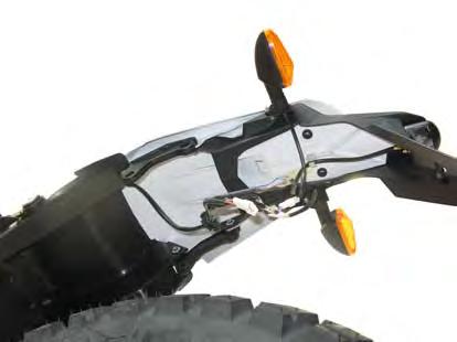 - Loosen the four screws (3) using an 8 mm Allen wrench and remove the mudguard (4) together with