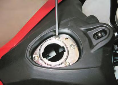 H01160 - Use a 3 mm Allen wrench to loosen the M5 screws (3) and a 4 mm Allen wrench to loosen the M6 screw (4); then remove the fuel cap flange.