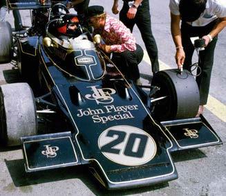 Right: 1972, Fittipaldi in the iconic black and gold livery debriefs Chapman. In 1948 Colin Chapman built his first car, following his own theories for improved performance.