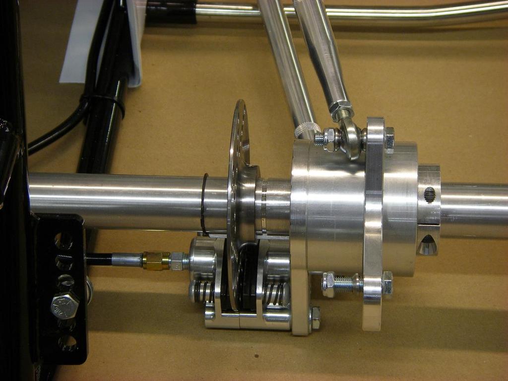Right Rear Axle Assembly Utilizing the provided hardware; bolt the radius rods to the birdcage as shown.
