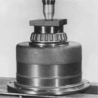 Press bearing cones on support cases (see photos).