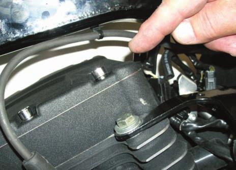 On a H-D OEM engine case you will have to remove the shifter rod nut and washers at the front gear shifter lever to get clearance to remove the OEM case bolt.