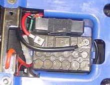 The battery should have a full charge. The battery is a gel acid battery and will not show any liquid electrolyte when fully absorbed.