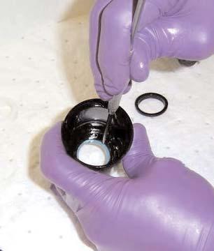 Using a sharp pick, remove the black rubber dust