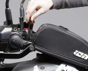 Individual adjustment for perfect fit through screw connection to tank bag Simply pivot downwards to engage REMOVE