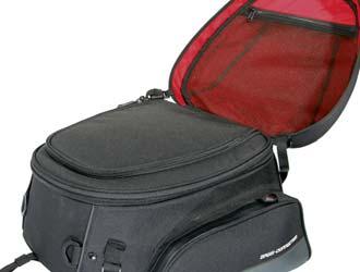 FEATURES > Retroreflective details > Zippered mesh compartment in the bag lid > 2 side bags > Carrying handle > 4 sturdy