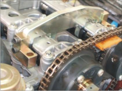 To retain timing chain with camshaft sprockets in mesh.