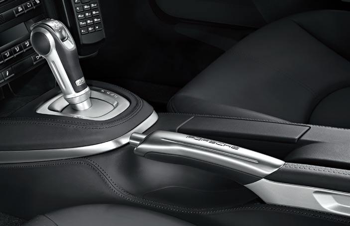 PDK gear selector and handbrake lever in aluminium PDK gear selector and handbrake lever in aluminium The package features a specially designed PDK gear selector and handbrake lever, both in