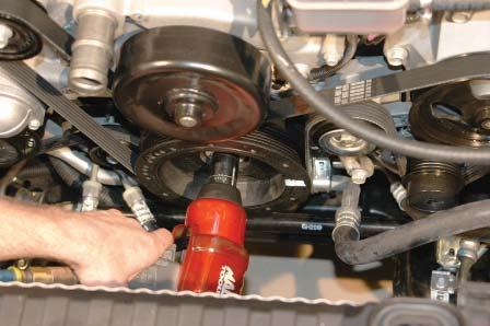 Using a 24mm socket tighten the new Harmonic Balancer bolt according to General