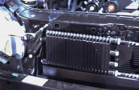 The radiator can now be pivoted back- ward toward the engine block for heat