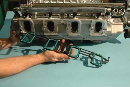 117. Snap the supplied intake manifold gaskets onto the new