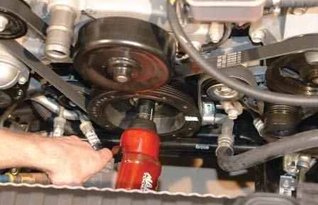 Install the new supplied factory GM Har- monic Balancer bolt. 52.