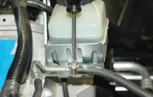 Using a 10mm socket wrench, remove the (2) bolts