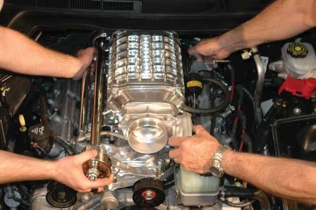 97. Install the Throttle Body on the super- charger using a 10mm socket wrench,