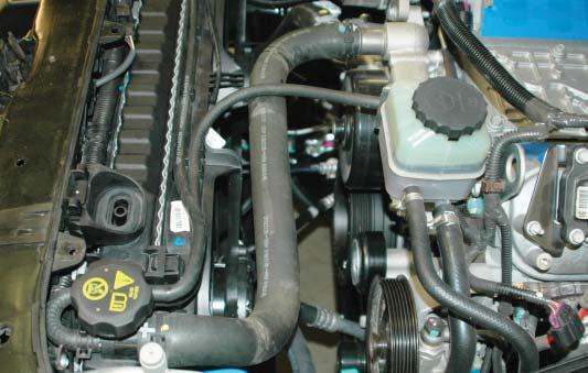 Re-install the upper radiator hose and secure in place with the