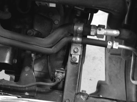 Engine mount bracket, using the Nylock nut and washer provided.