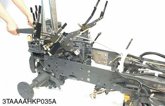 Before mounting the transaxle assembly on the tracr main frame, check the flatness of the frame brackets with