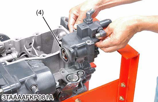 Since the mounting bolt (2) is installed through the hydraulic pump the transaxle case,