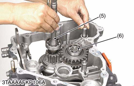 After installing the rear PTO cover the transaxle case, install the PTO select gear shaft