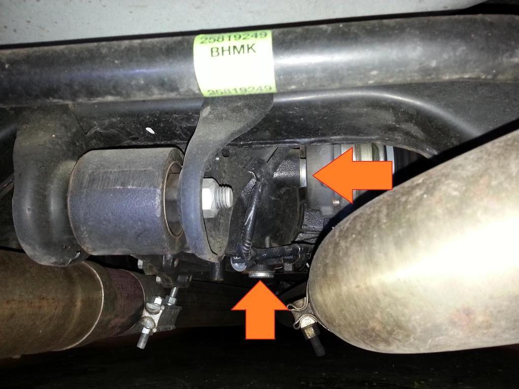 You may or may not need to jack up your car to complete this project. From the rear of the car locate the differential drain plug and fill plug.
