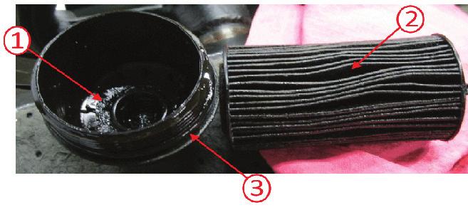 Engine Concerns Resulting from Improper Service continued from page 1 1. Sludge on cap 2. Sludge on filter pleats 3.
